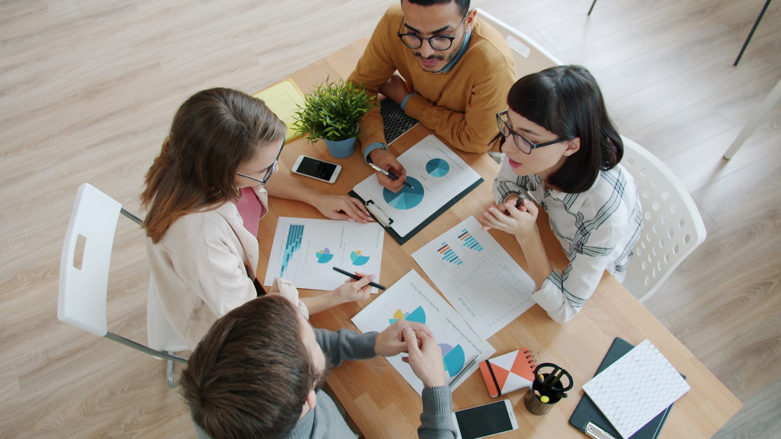 Family reviewing tax documents and household finances together — MyFolio360 Tax Saver